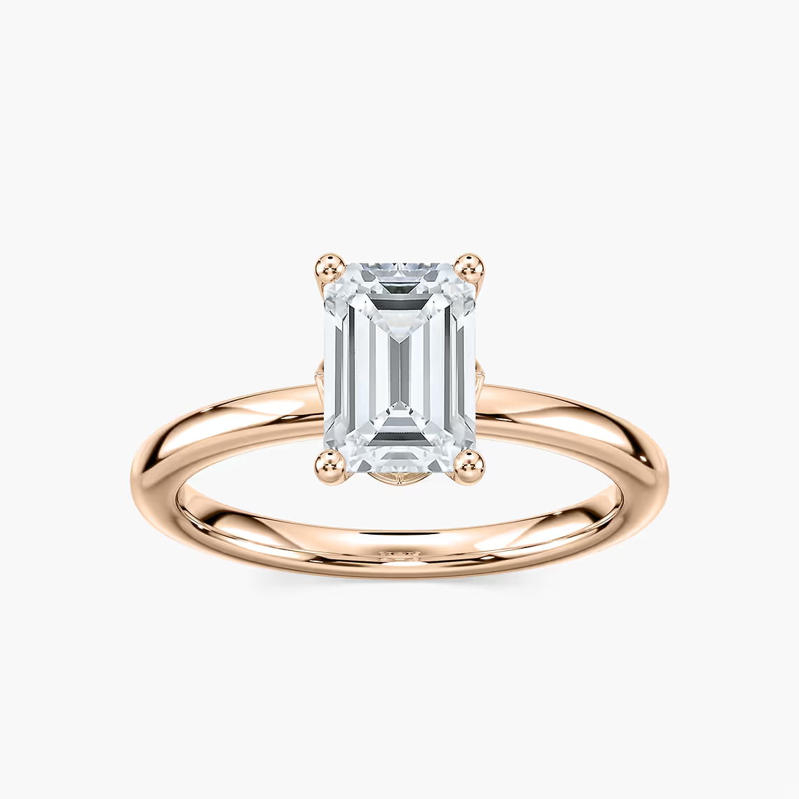 Delicate Four-Prong Emerald Cut Solitaire Engagement Ring