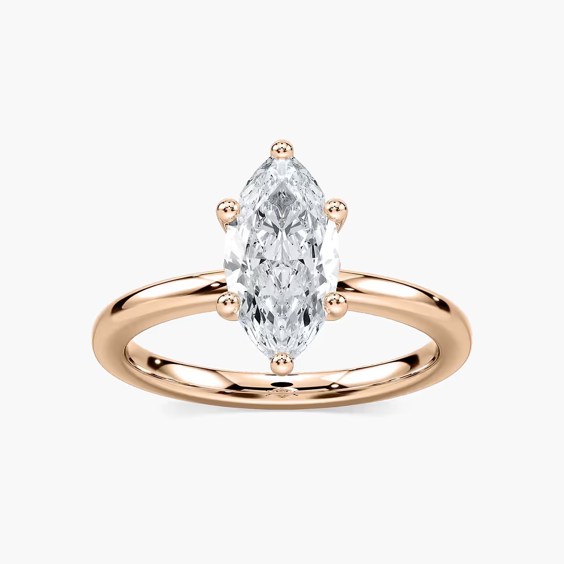 Delicate Four-Prong Marquise Cut Solitaire Engagement Ring