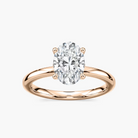 Delicate Four-Prong Oval Solitaire Engagement Ring