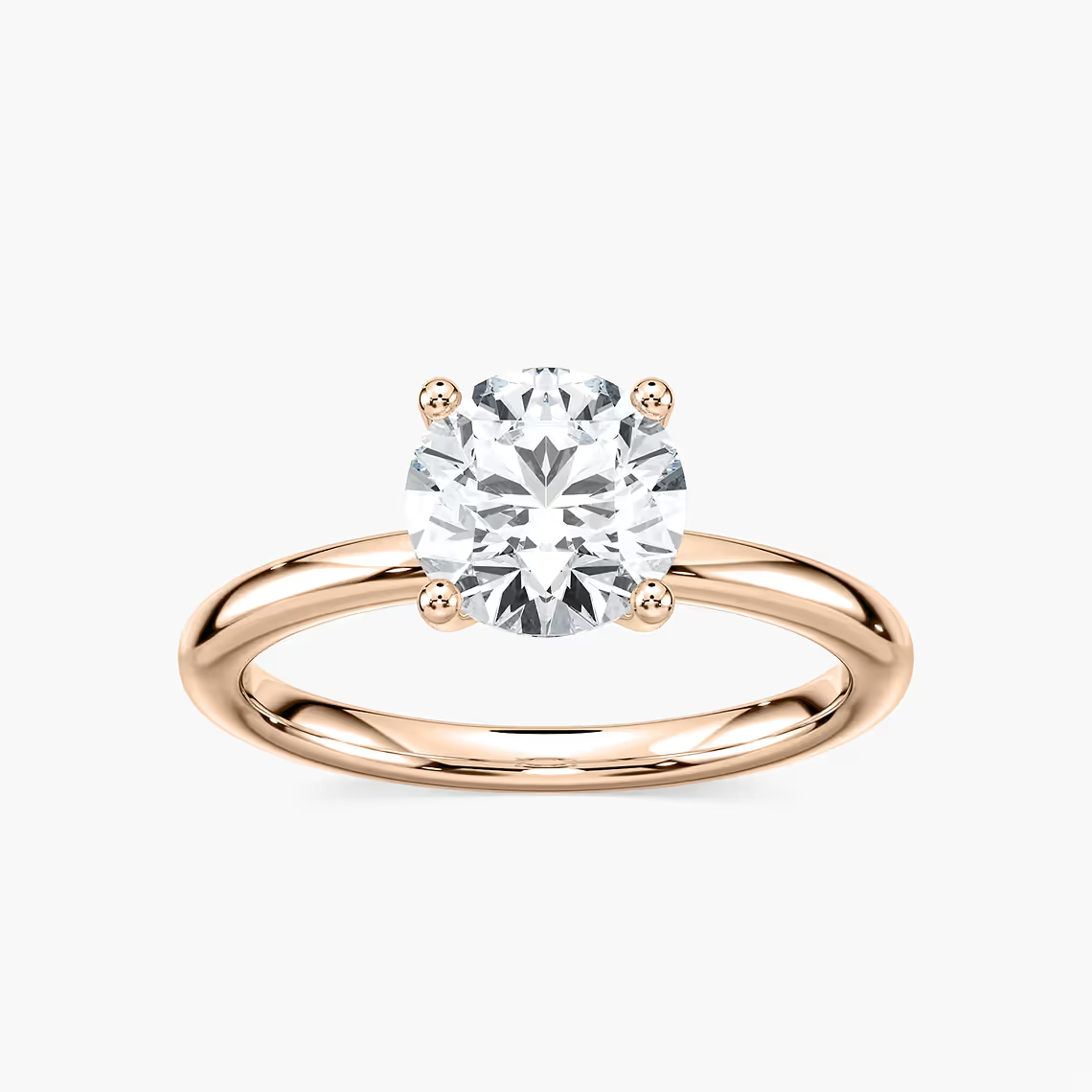 Delicate Four-Prong Round Cut Solitaire Engagement Ring