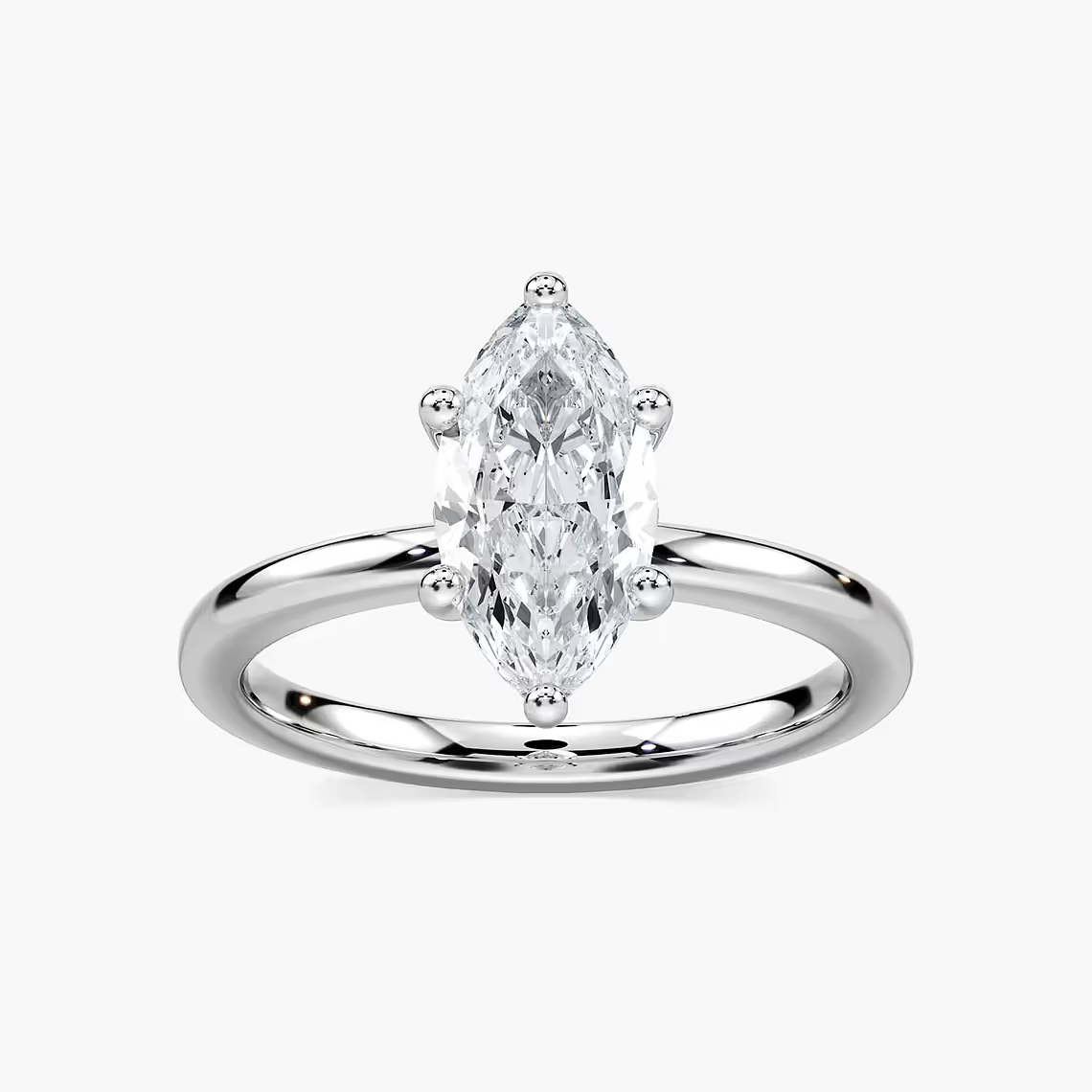 Delicate Four-Prong Marquise Cut Solitaire Engagement Ring