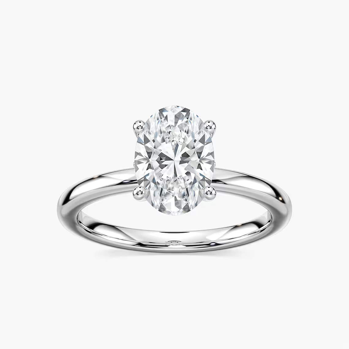 Delicate Four-Prong Oval Solitaire Engagement Ring