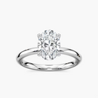Delicate Four-Prong Oval Solitaire Engagement Ring
