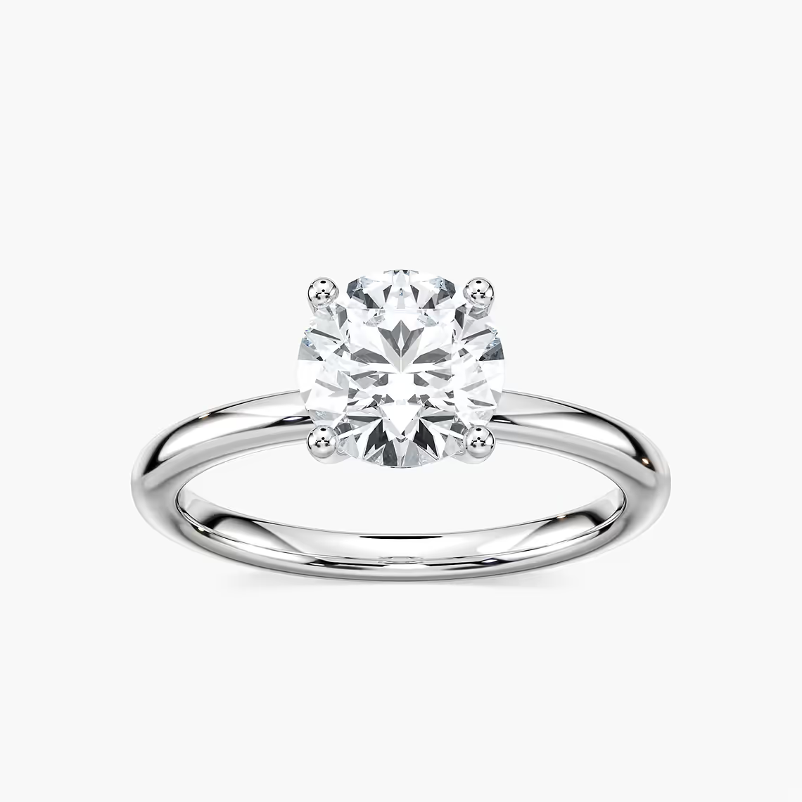 Delicate Four-Prong Round Cut Solitaire Engagement Ring