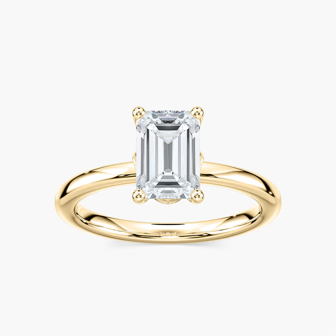 Delicate Four-Prong Emerald Cut Solitaire Engagement Ring