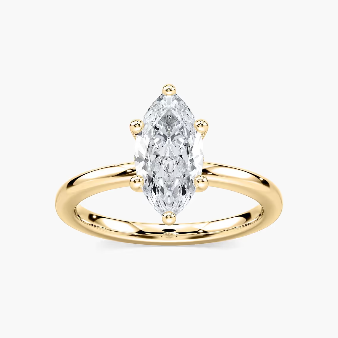 Delicate Four-Prong Marquise Cut Solitaire Engagement Ring