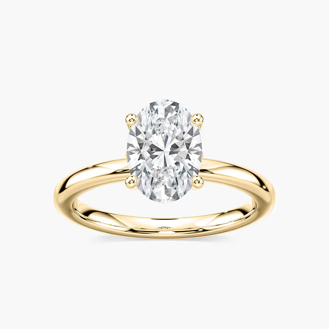 Delicate Four-Prong Oval Solitaire Engagement Ring