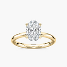 Delicate Four-Prong Oval Solitaire Engagement Ring