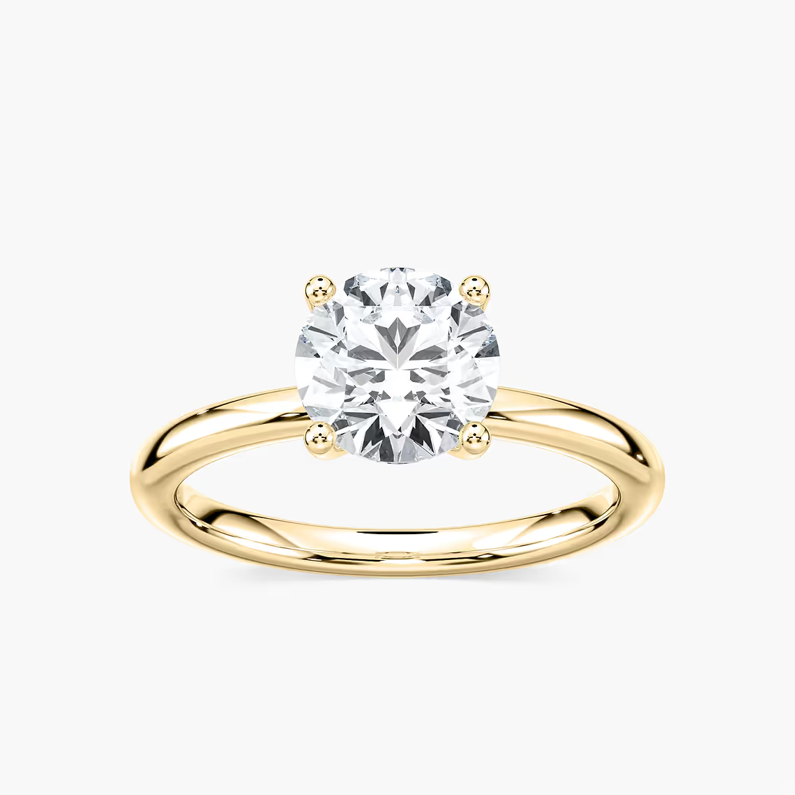 Delicate Four-Prong Round Cut Solitaire Engagement Ring