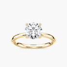 Delicate Four-Prong Round Cut Solitaire Engagement Ring