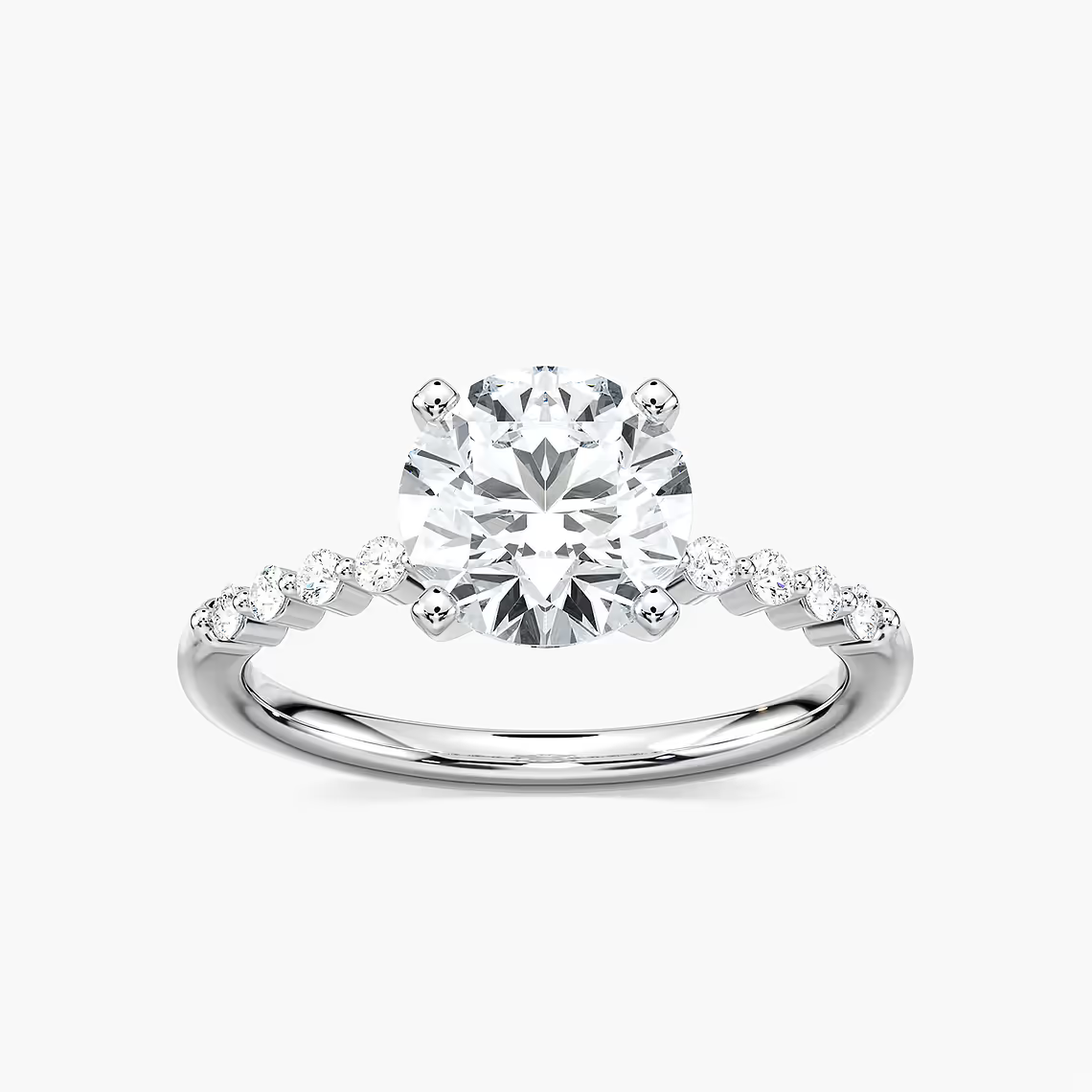 Round Cut Shared Prong Side Stone Engagement Ring