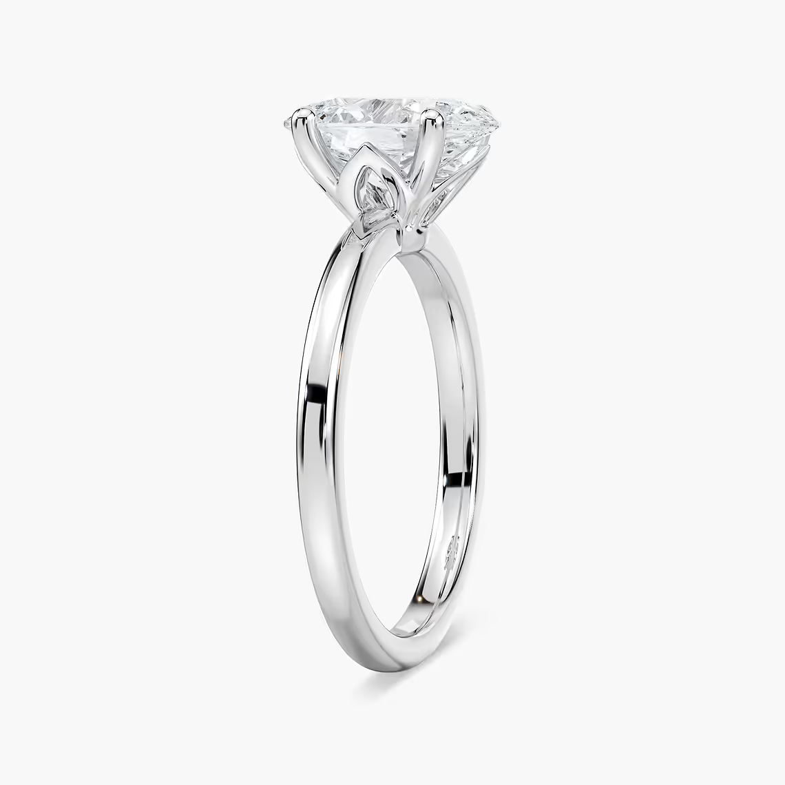 Delicate Four-Prong Oval Solitaire Engagement Ring