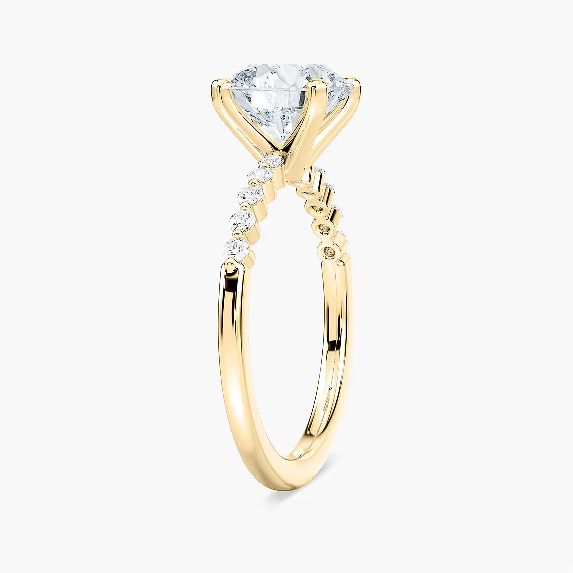 Round Cut Shared Prong Side Stone Engagement Ring