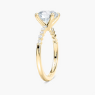 Round Cut Shared Prong Side Stone Engagement Ring