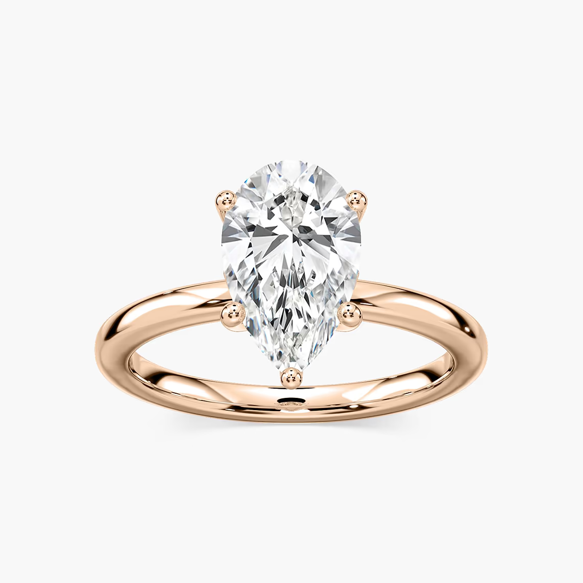 Delicate Four-Prong Pear Shaped Solitaire Engagement Ring