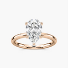 Delicate Four-Prong Pear Shaped Solitaire Engagement Ring