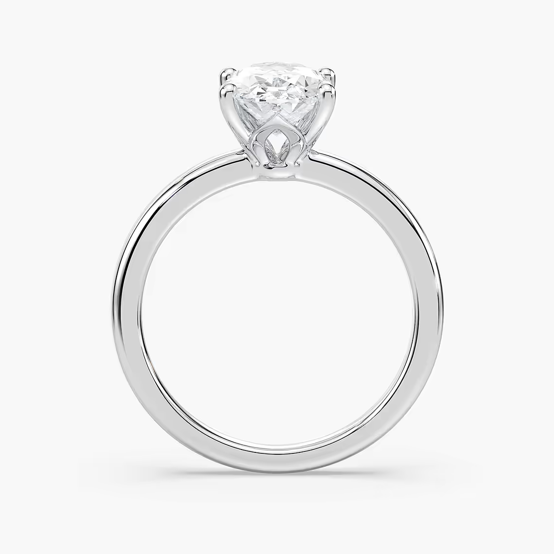 Delicate Four-Prong Oval Solitaire Engagement Ring