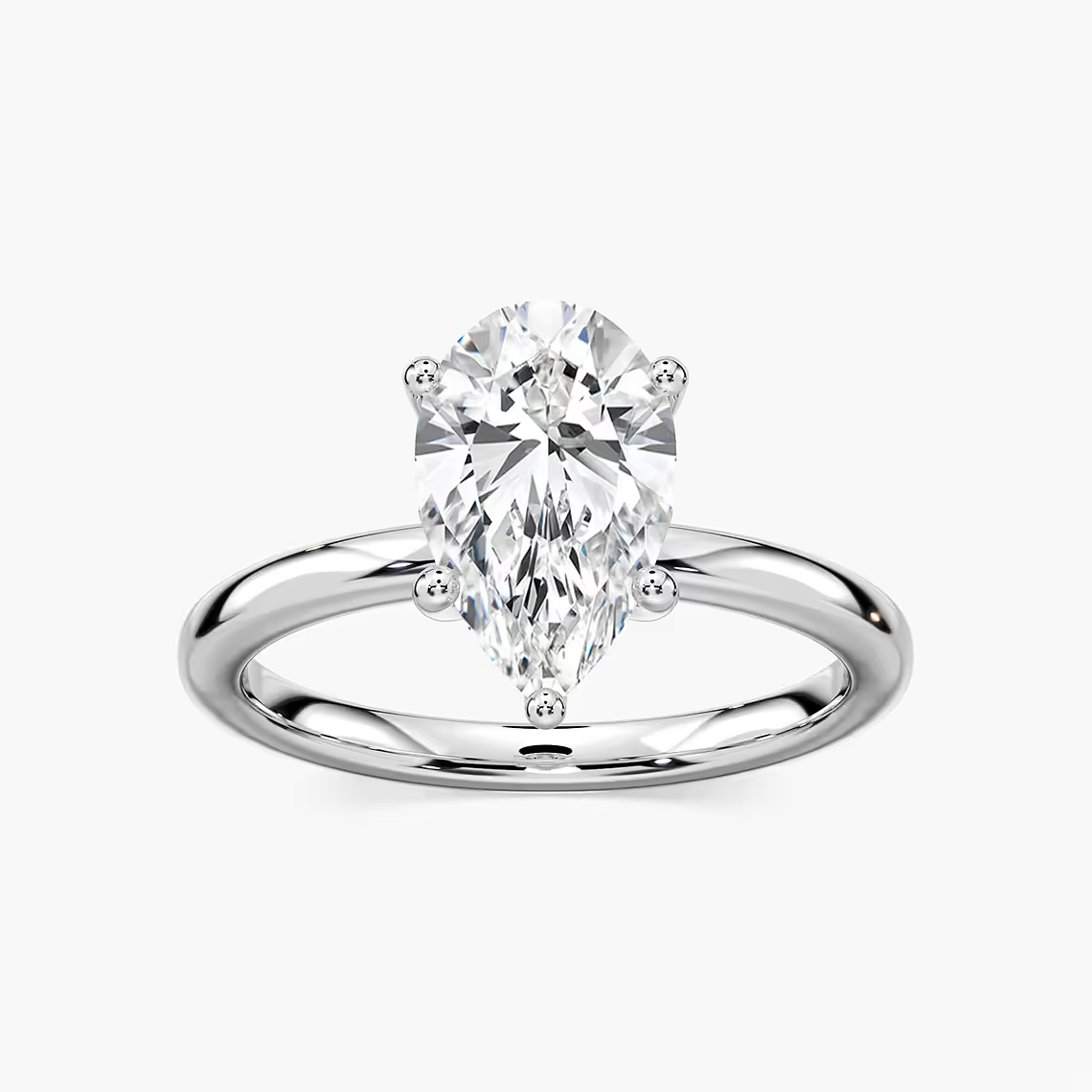 Delicate Four-Prong Pear Shaped Solitaire Engagement Ring
