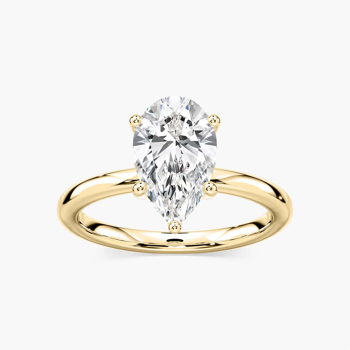 Delicate Four-Prong Pear Shaped Solitaire Engagement Ring