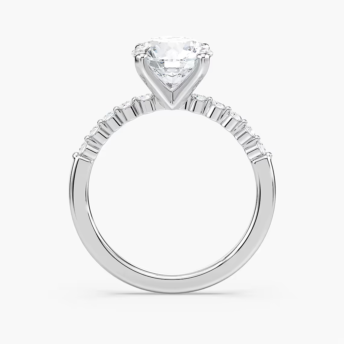 Round Cut Shared Prong Side Stone Engagement Ring