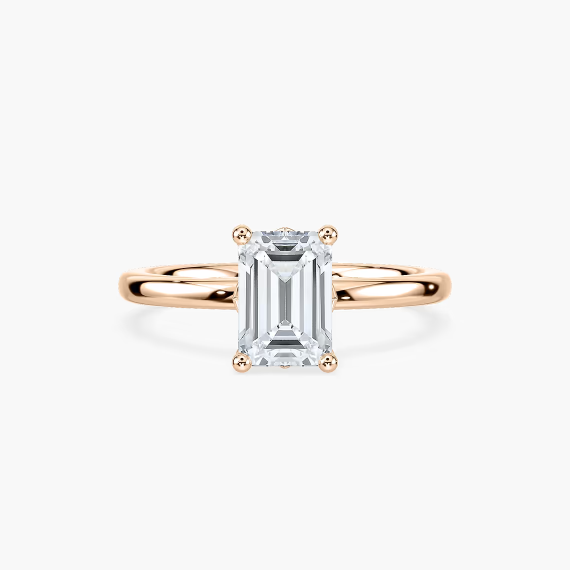 Delicate Four-Prong Emerald Cut Solitaire Engagement Ring