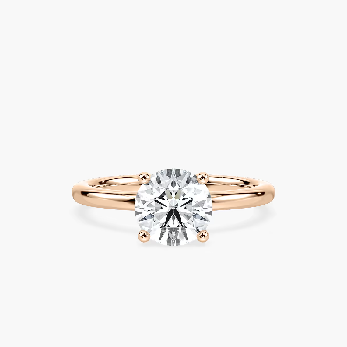 Delicate Four-Prong Round Cut Solitaire Engagement Ring