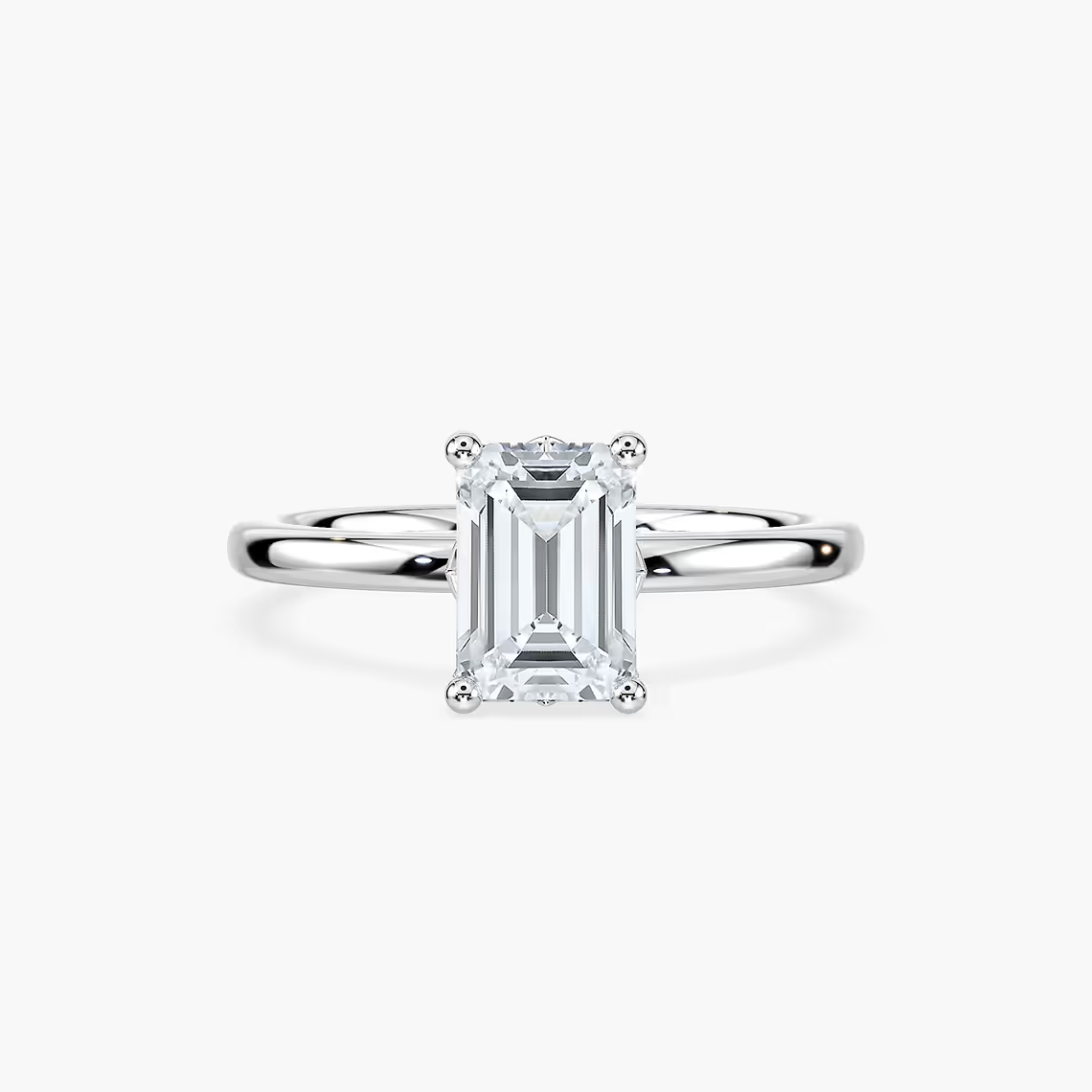 Delicate Four-Prong Emerald Cut Solitaire Engagement Ring