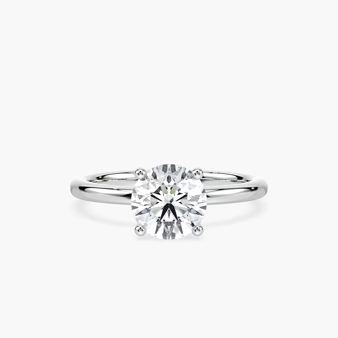 Delicate Four-Prong Round Cut Solitaire Engagement Ring