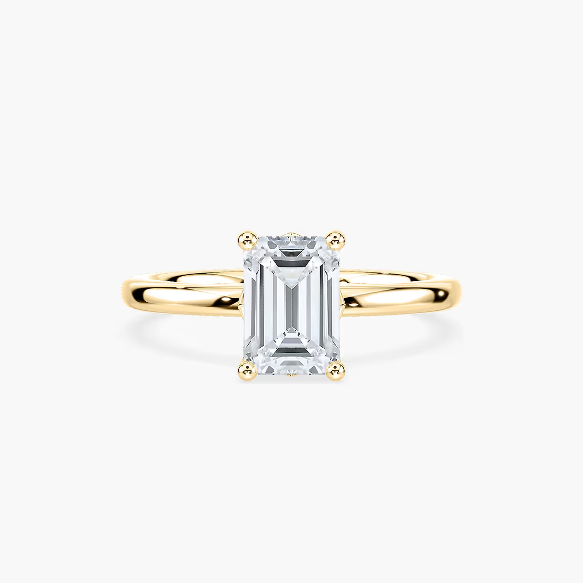 Delicate Four-Prong Emerald Cut Solitaire Engagement Ring