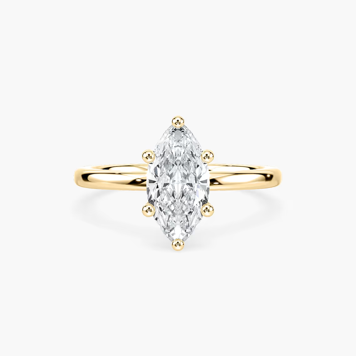 Delicate Four-Prong Marquise Cut Solitaire Engagement Ring