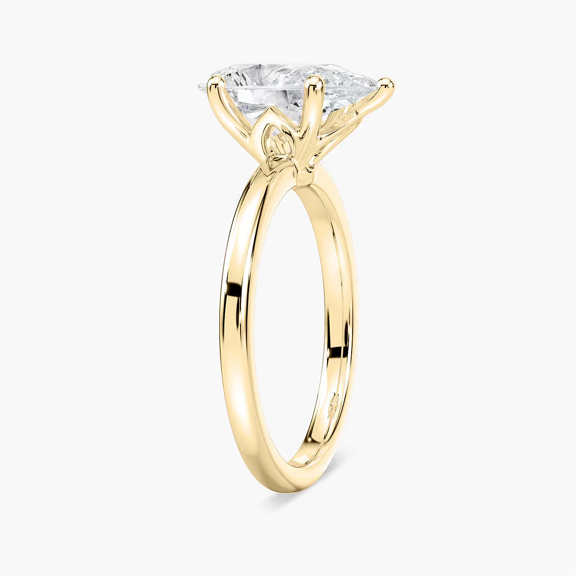 Delicate Four-Prong Pear Shaped Solitaire Engagement Ring
