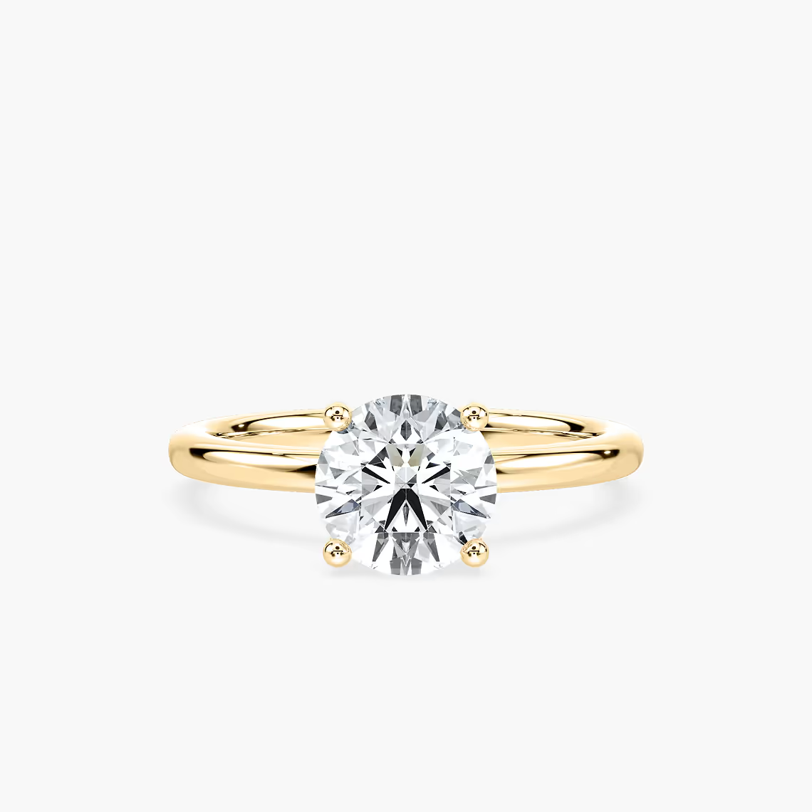 Delicate Four-Prong Round Cut Solitaire Engagement Ring