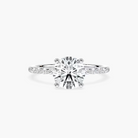 Round Cut Shared Prong Side Stone Engagement Ring