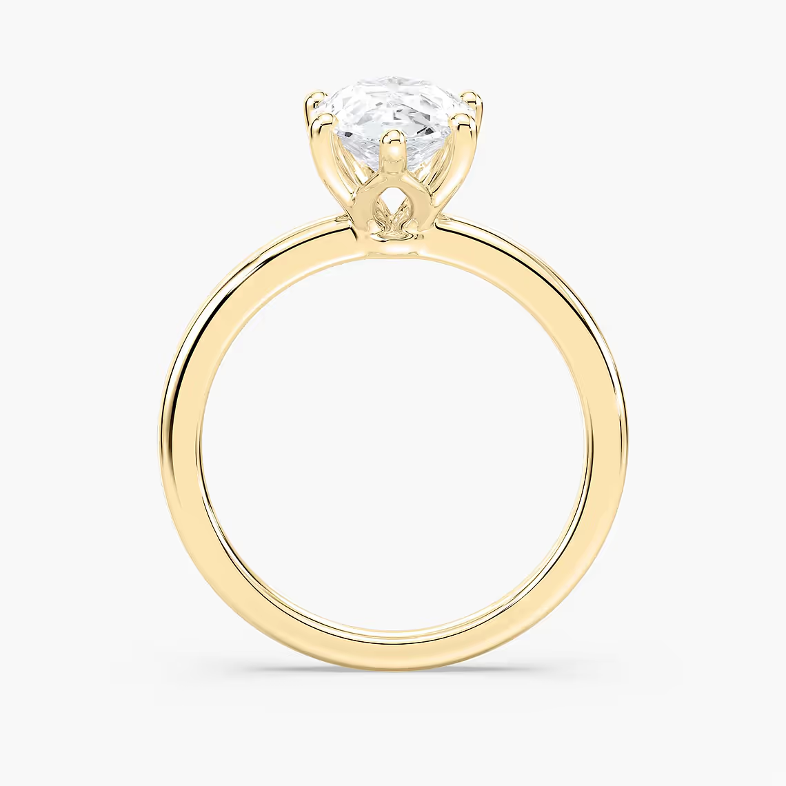 Delicate Four-Prong Pear Shaped Solitaire Engagement Ring