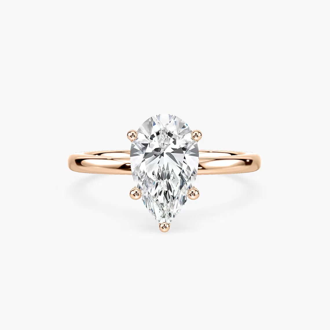 Delicate Four-Prong Pear Shaped Solitaire Engagement Ring