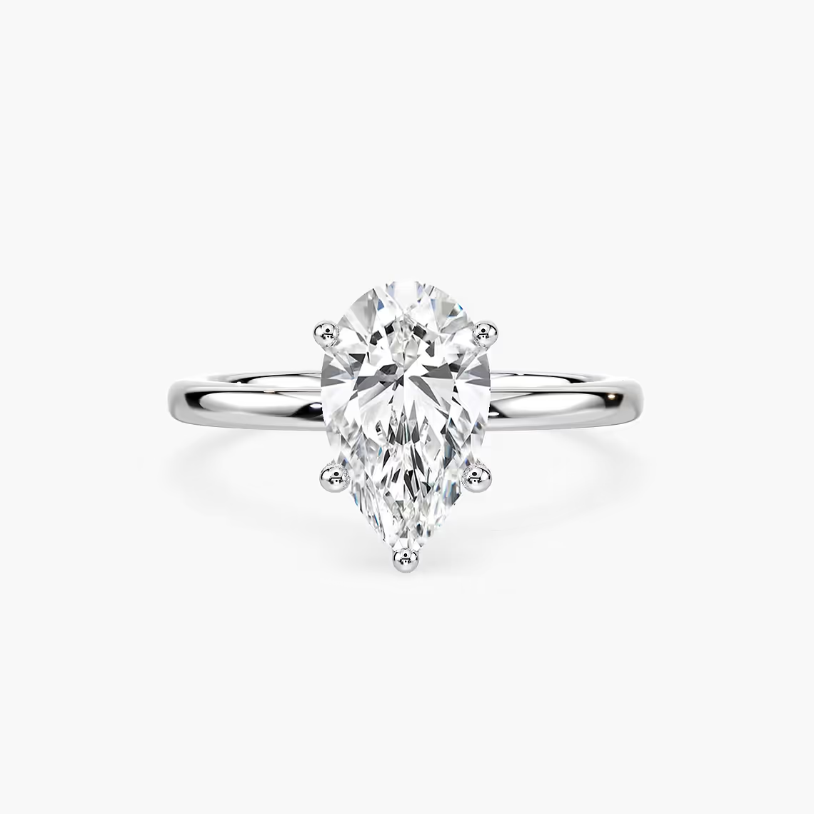 Delicate Four-Prong Pear Shaped Solitaire Engagement Ring