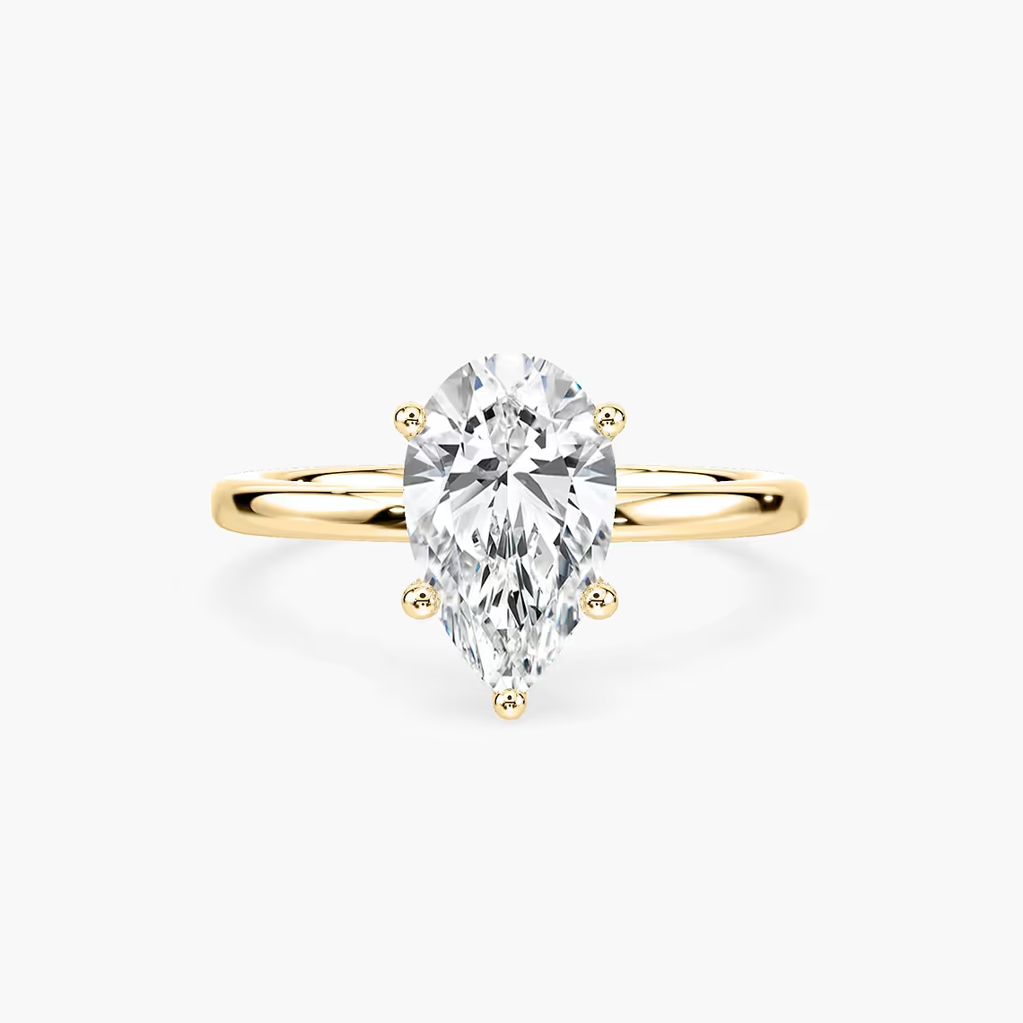 Delicate Four-Prong Pear Shaped Solitaire Engagement Ring