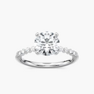 Round Cut Shared Prong Side Stone Engagement Ring