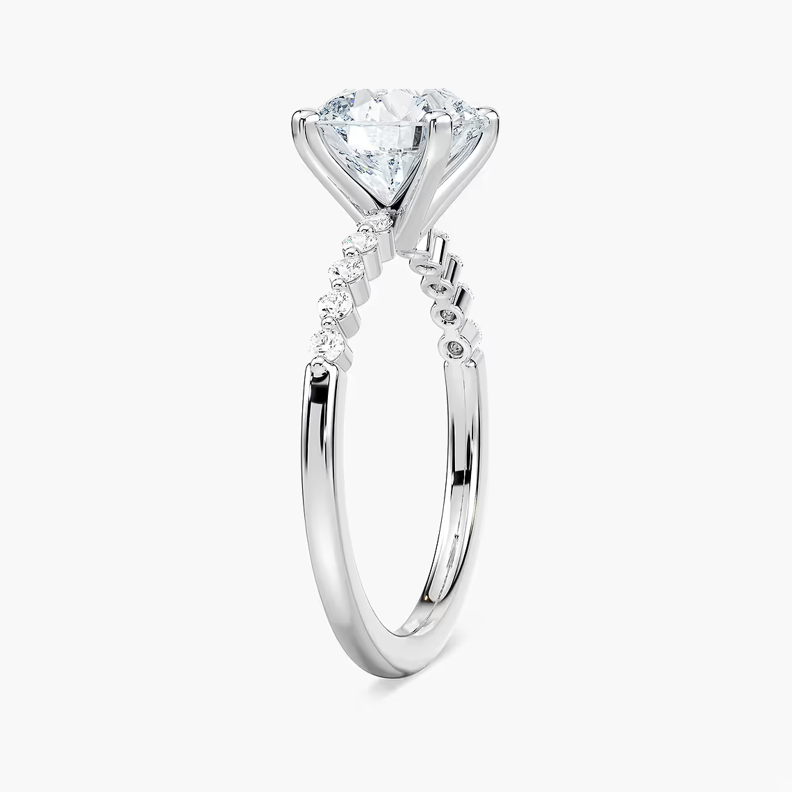Round Cut Shared Prong Side Stone Engagement Ring