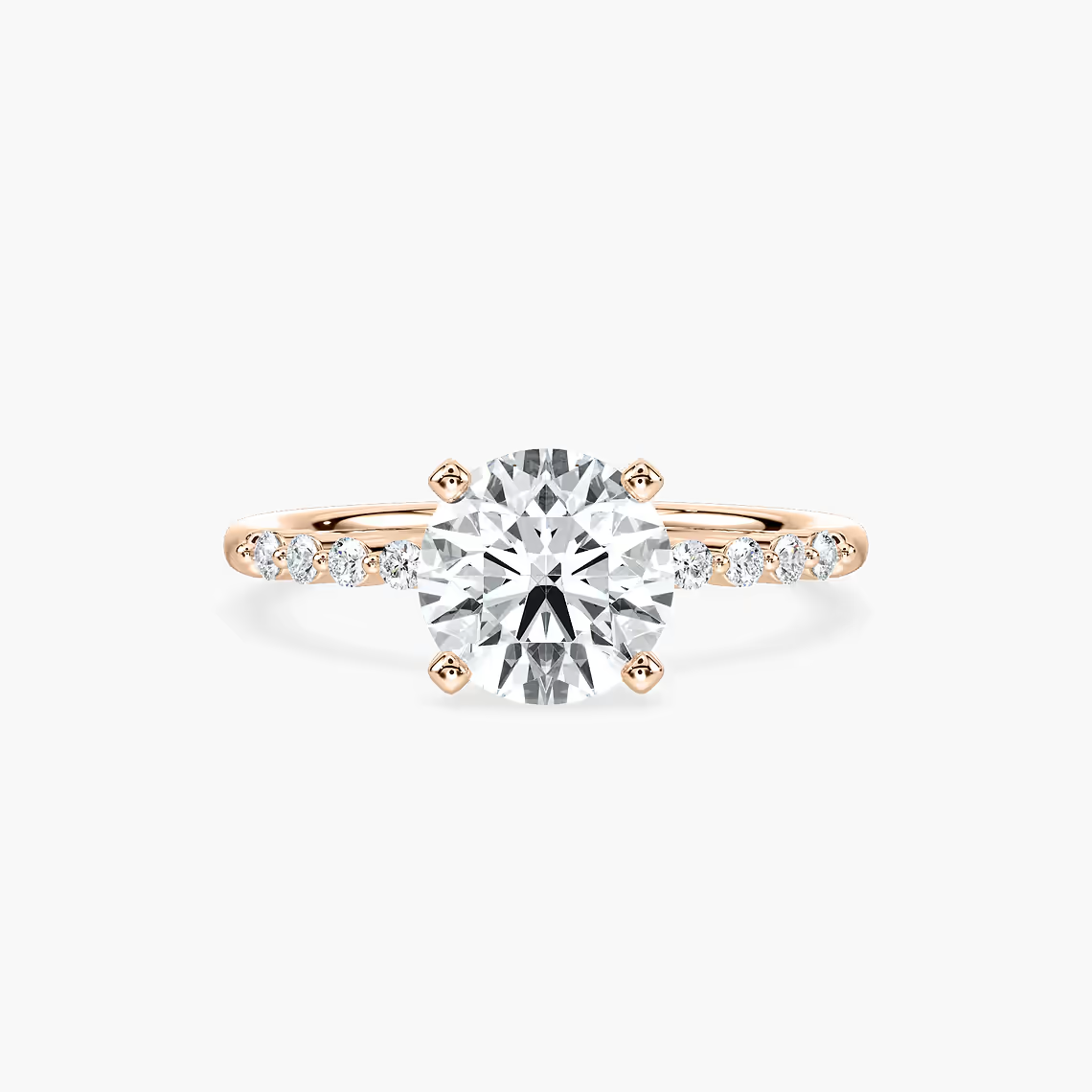 Round Cut Shared Prong Side Stone Engagement Ring