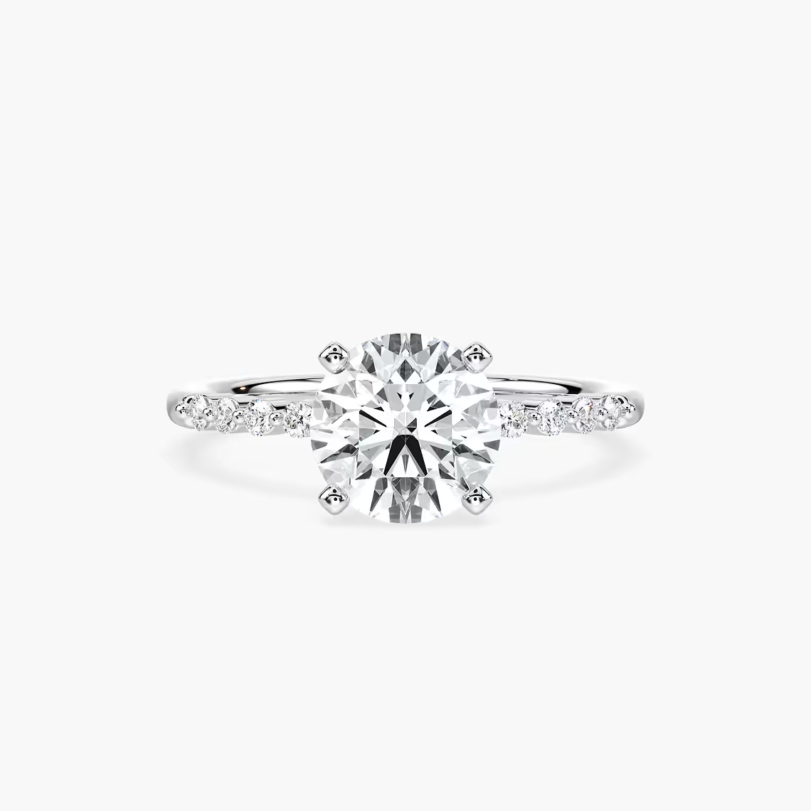 Round Cut Shared Prong Side Stone Engagement Ring