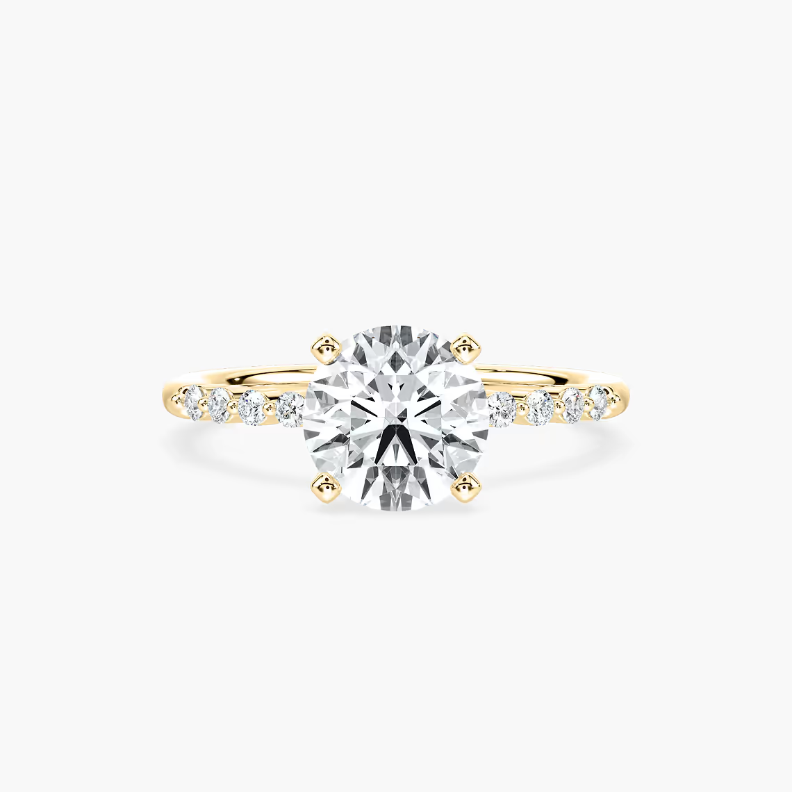 Round Cut Shared Prong Side Stone Engagement Ring